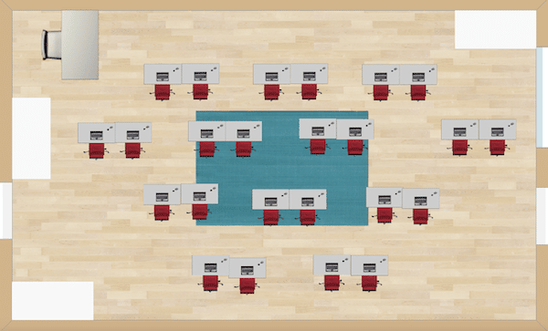 Pairs of desks are arranged resembling rows and columns.  The desks are staggered so that all students have equal access to view the teacher or board up front.